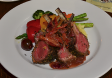 rack of lamb on a white plate